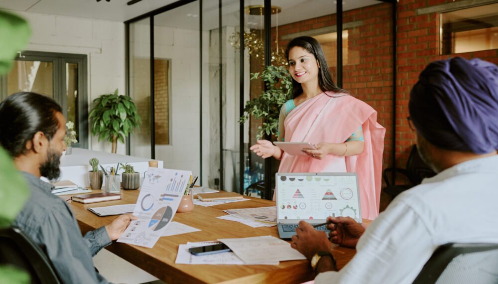 Female Colleague Speaking to Coworkers