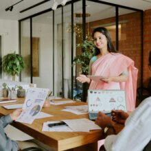 Female Colleague Speaking to Coworkers