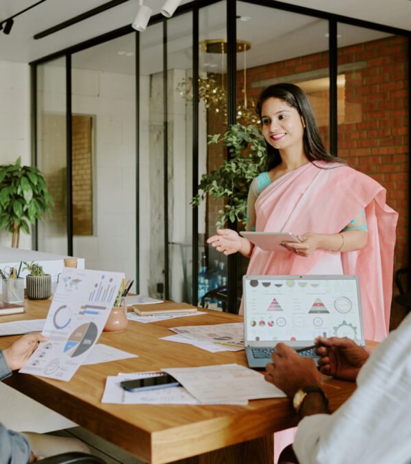 Female Colleague Speaking to Coworkers