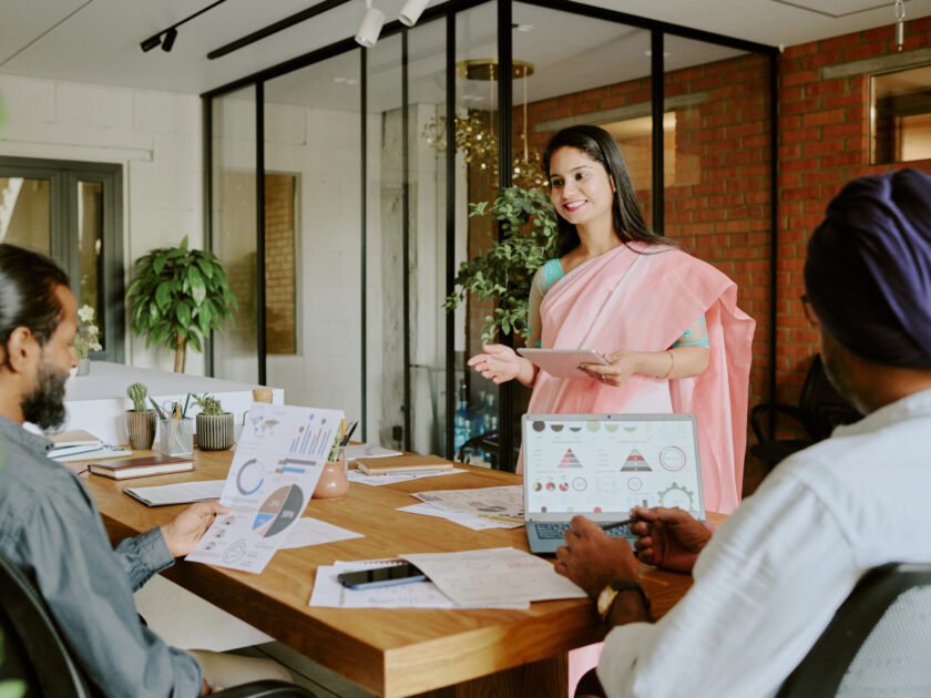 Female Colleague Speaking to Coworkers