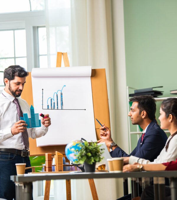 group-of-businesspeople-looking-at-young-indian-as-2024-06-03-22-32-05-utc